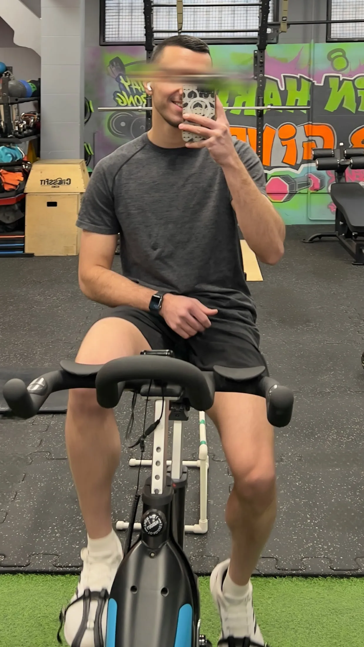 Me on a stationary bicycle during an indoor gym session