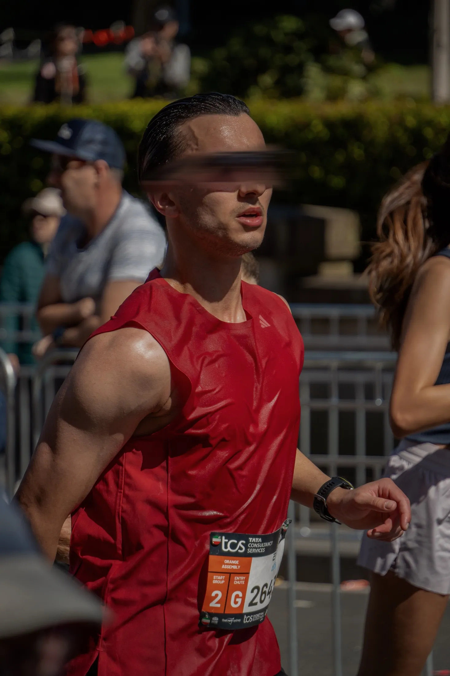 Me in a red race singlet during a road race