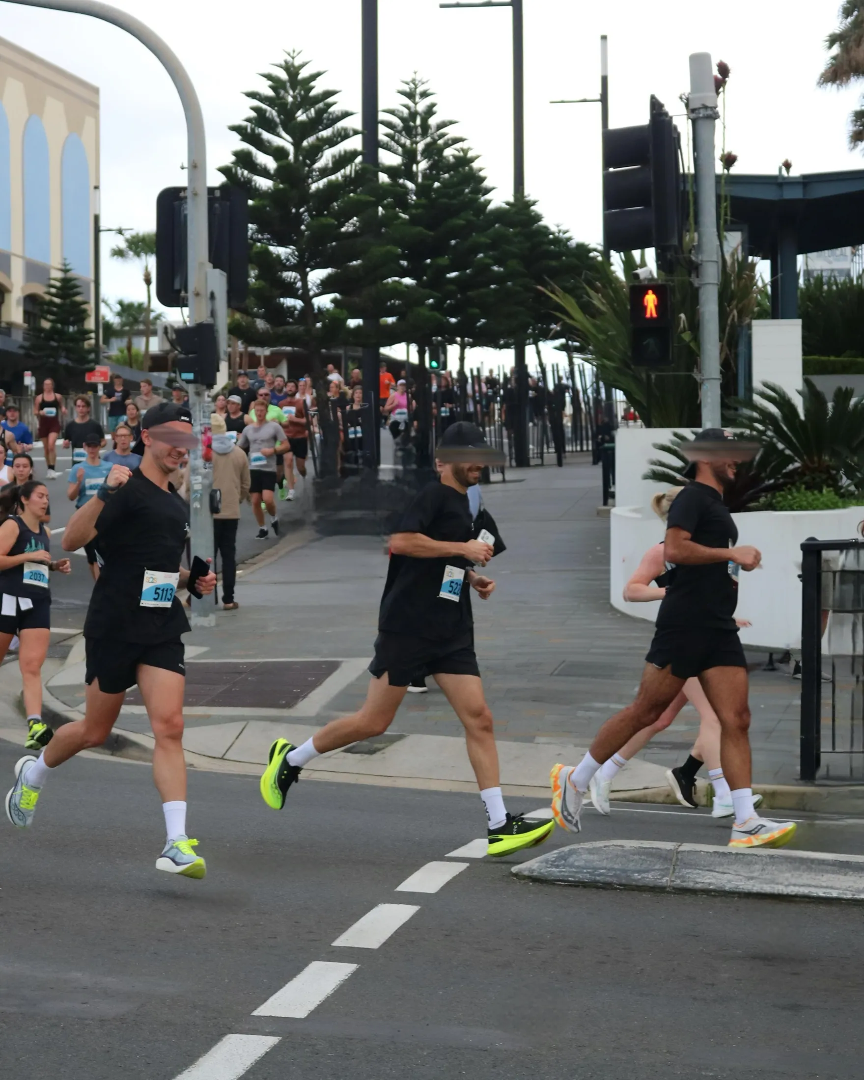 Runners moving through a city street during one of my races